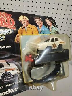 1980 Dukes of Hazzard General Lee & Police Cruiser Wrist Racers NEW Unpunched
