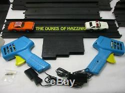 1981 IDEAL DUKES of HAZZARD SLOT CAR RACING SET w GENERAL LEE & POLICE CAR SLOT