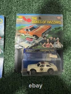 The Dukes of Hazzard the General Lee car and a Hazzard County police cruiser