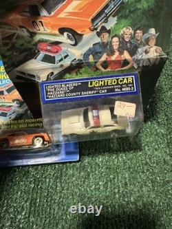 The Dukes of Hazzard the General Lee car and a Hazzard County police cruiser